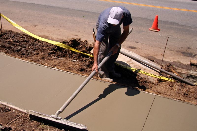 Workers Preparing Sidewalks